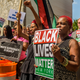 Over a hundred people gathered in front of the home of Dwayne Jeune, who was killed by New York City police, in Brooklyn, N.Y., on Aug. 19, 2017, to protest the killing of the mentally ill by the New York City Police Department. (Erik McGregor/Pacific Press/LightRocket via Getty Images)